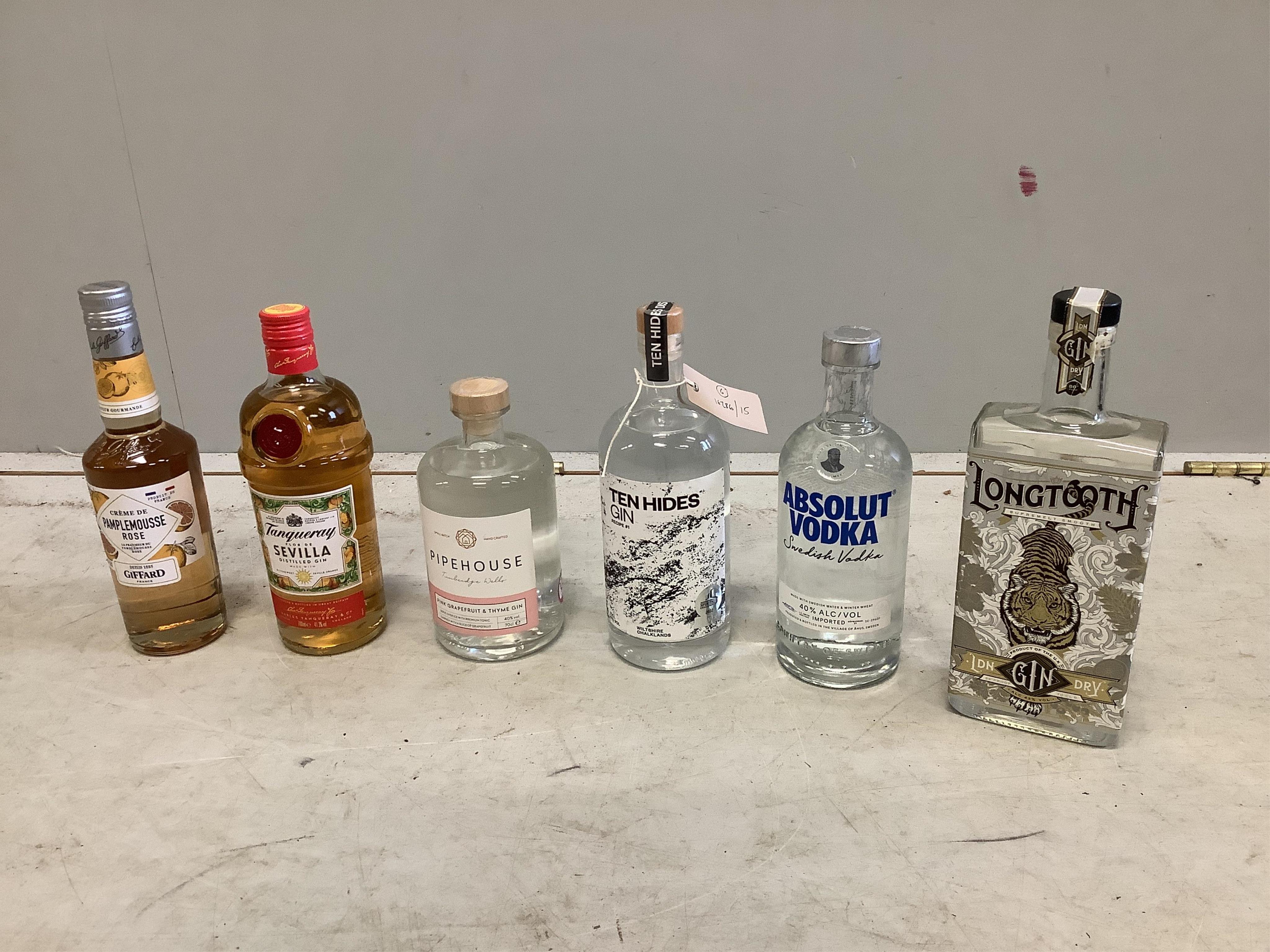 Three bottles of craft gin, Longtooth, Pipehouse and Ten Hides, a bottle of Tanqueray Sevillia, a bottle of Pamplemousse Rose and a bottle of Absolut Vodka (6). Surplus stock from a local wedding planner. Condition - goo